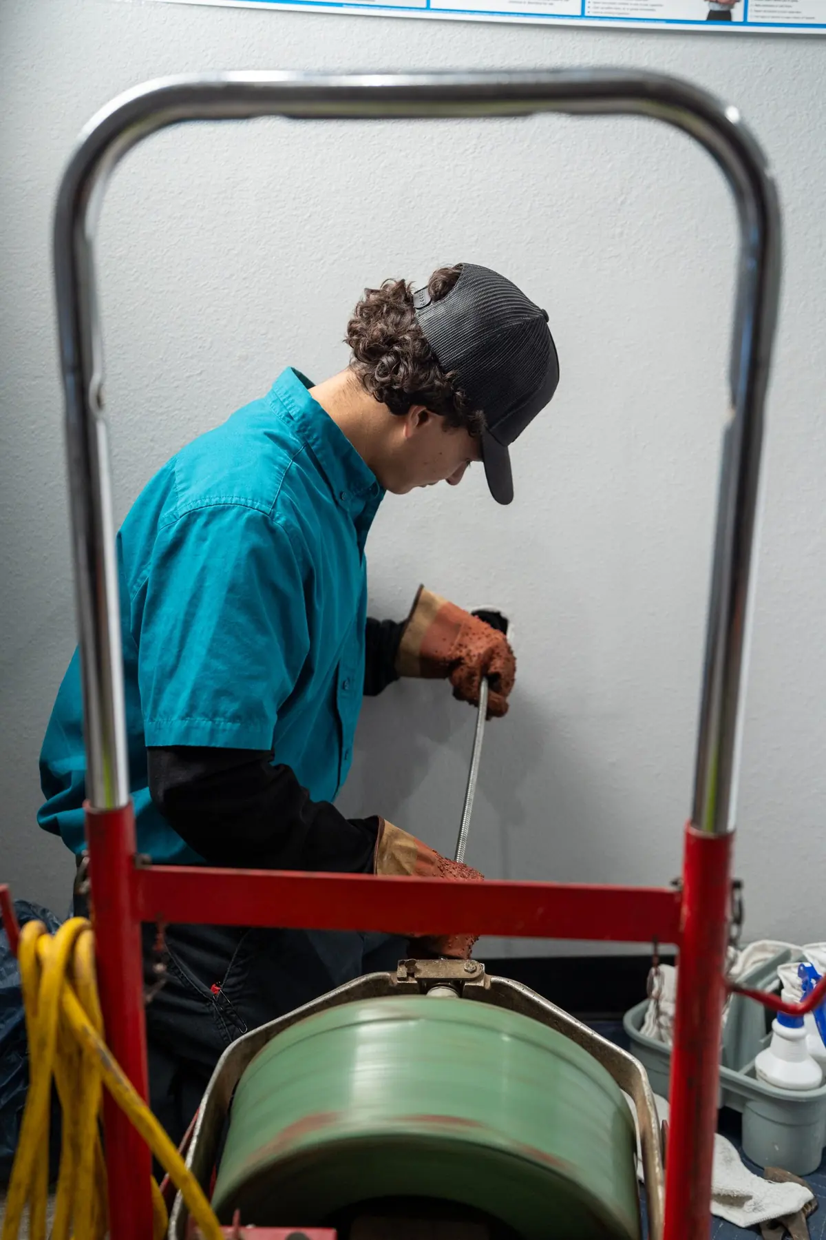 Elite Rooter drain cleaning technician working in the field