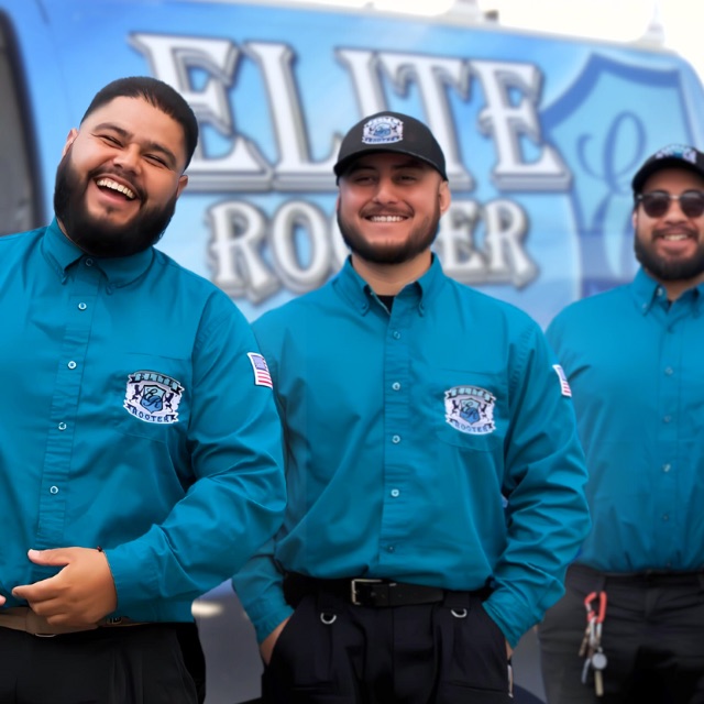 Three Elite Rooter technicians beside a branded service vehicle
