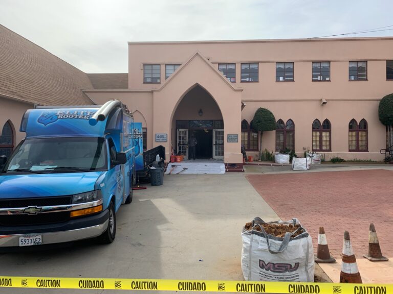 Elite Rooter service van at an active plumbing project