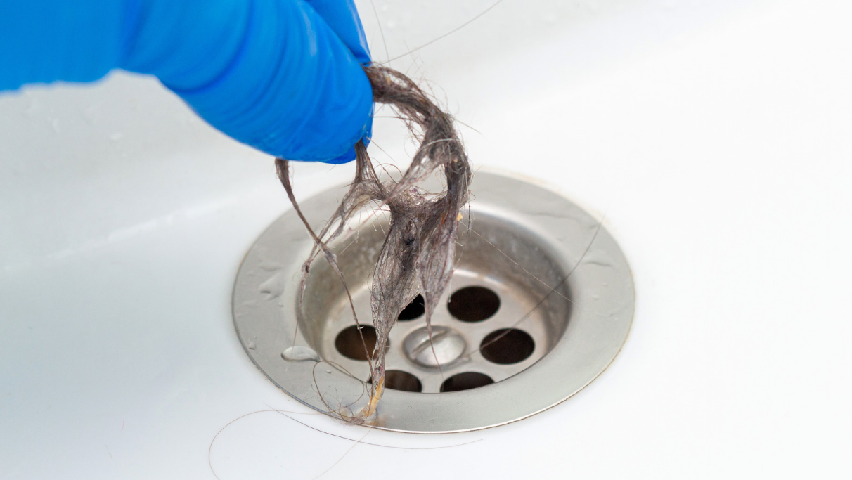 Is It Okay to Flush Hair Down the Toilet? (Does Hair Clog the Toilet)