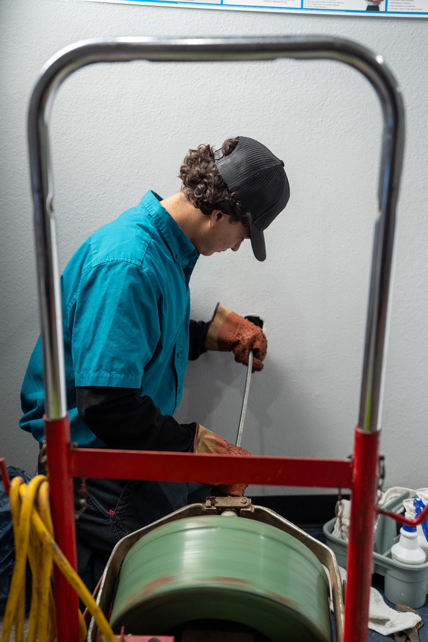 Elite Rooter drain cleaning technician working in the field